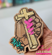 Hand Holding Cross Snob Scentiez - Custom Designed Air Freshener